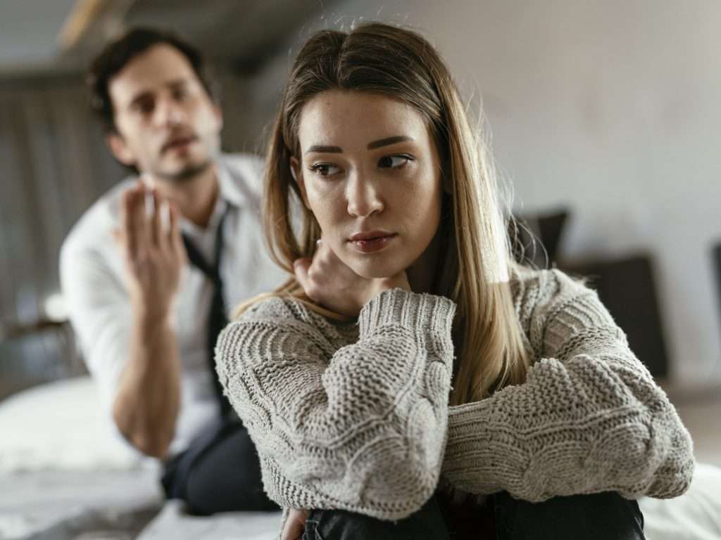 how to tell if someone is gaslighting you in a relationship. A woman wondering what does it mean to gaslight someone.