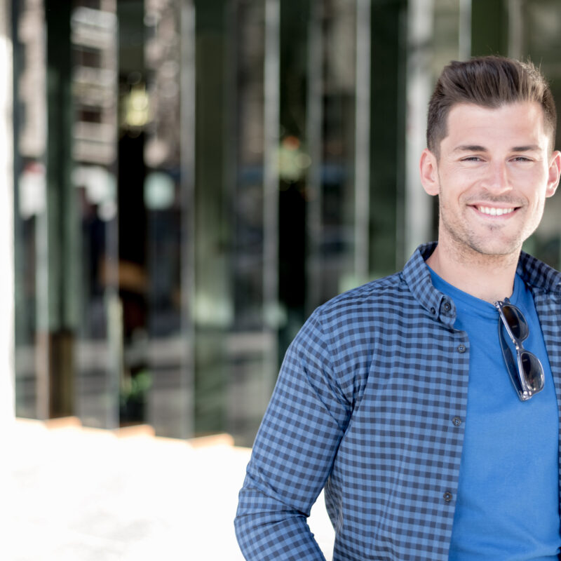 A young man smiling after treating depression to avoid a Lexapro Overdose